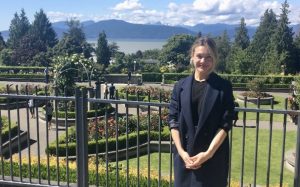 UBC FHIS PhD student, Liza, standing in front of the UBC rose garden.