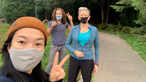 Three staff outdoors wearing masks