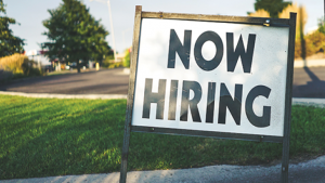 Sign that says "Now Hiring"