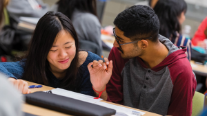 Student tutoring another student.