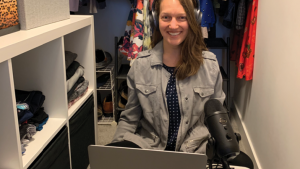 Tamara Mitchell recording podcast episodes in her closet