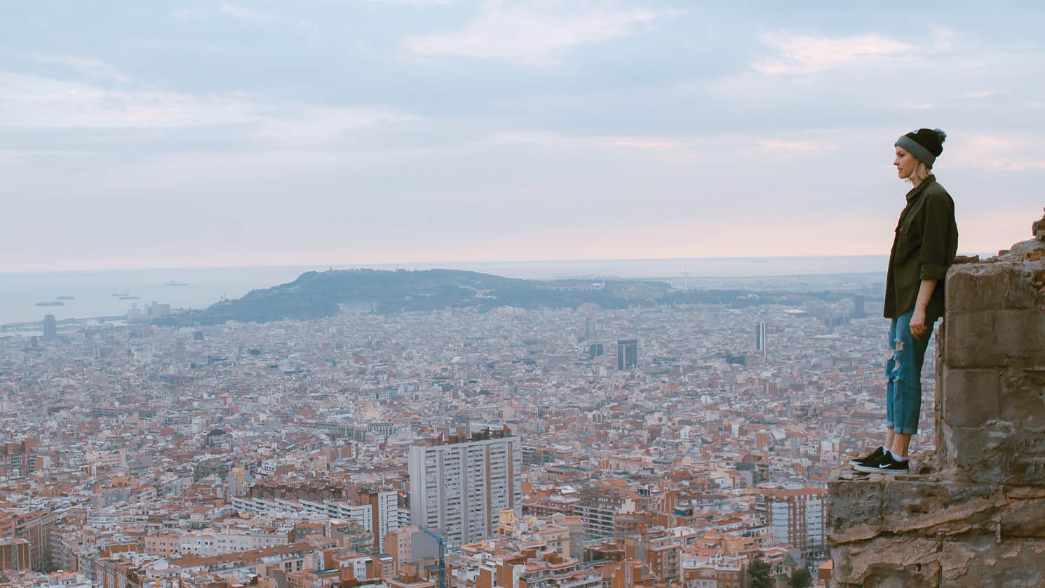 Student overlooking a European city view.